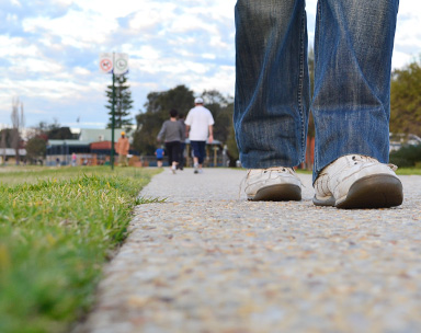 Person walking on footpath in Perth